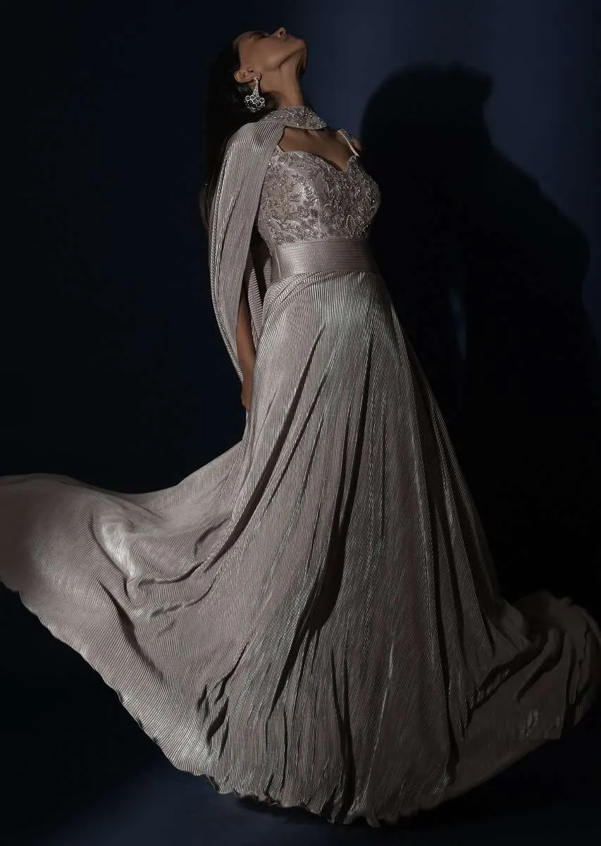 Champagne Gown In Crushed Shimmer With An Embellished Bodice Highlighting The Waistline And Fancy Cape